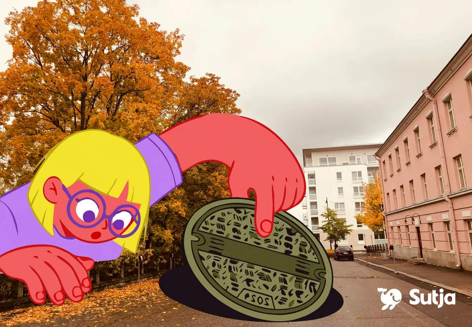 Piirroshahmo nostaa kaivonkantta syksyisellä kadulla Kuopiossa